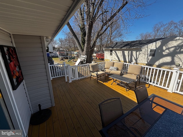 wooden terrace featuring an outdoor living space