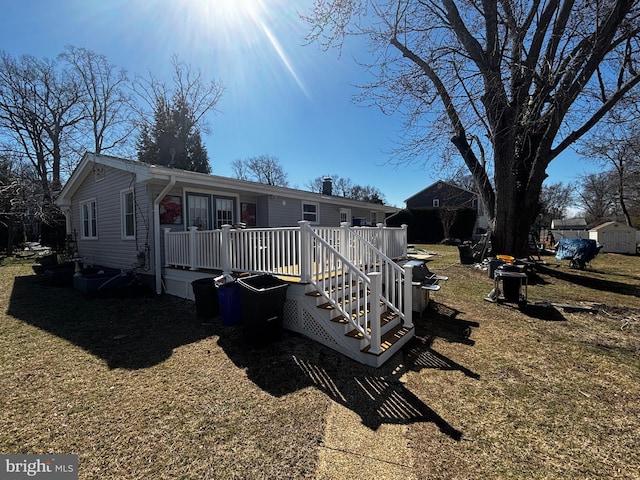 exterior space featuring a yard and a deck