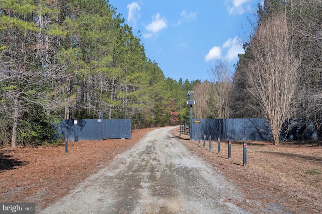 view of street featuring a wooded view