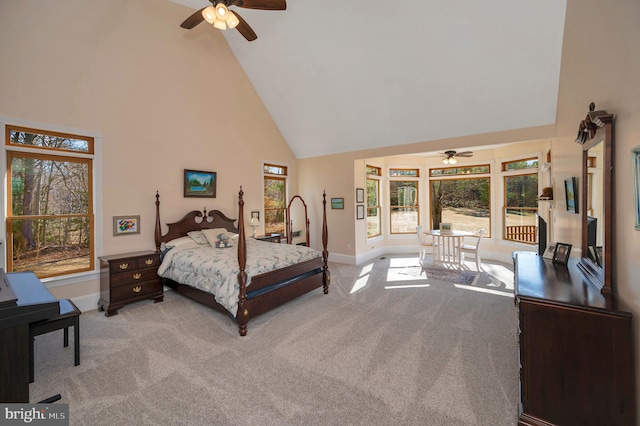 bedroom with baseboards, high vaulted ceiling, and carpet flooring