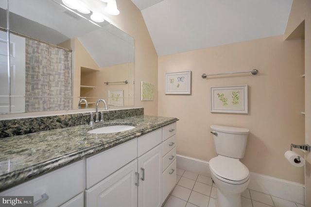 full bath with visible vents, toilet, vaulted ceiling, vanity, and tile patterned flooring