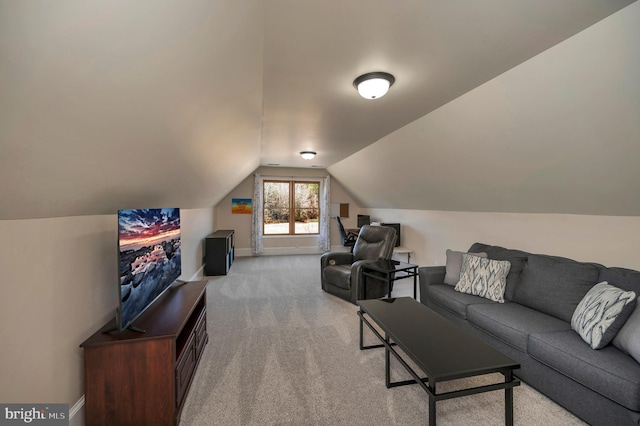 living room featuring carpet flooring, vaulted ceiling, and baseboards