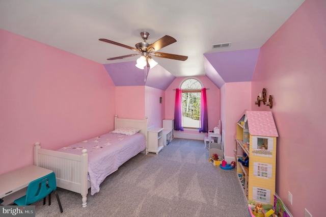 bedroom featuring baseboards, visible vents, a ceiling fan, vaulted ceiling, and carpet floors