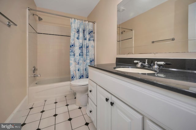 bathroom featuring tile patterned flooring, toilet, vanity, baseboards, and shower / tub combo with curtain