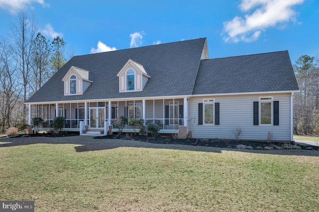 cape cod home featuring covered porch, a shingled roof, and a front yard