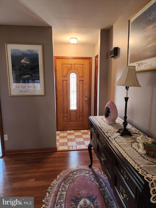 foyer entrance featuring light wood finished floors