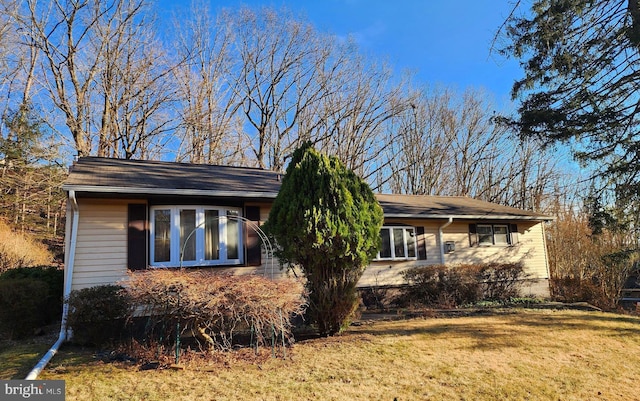 view of home's exterior with a lawn