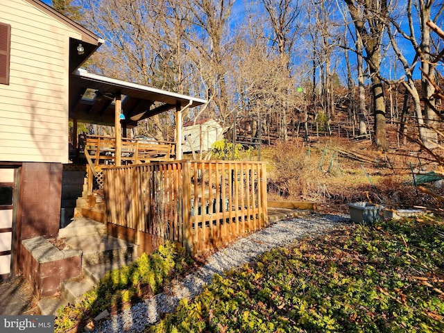 view of yard featuring stairs and a deck