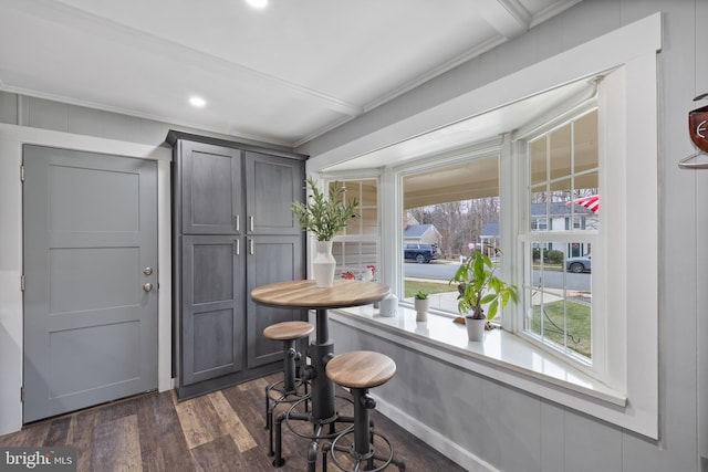 dining area with dark wood-type flooring, recessed lighting, and ornamental molding