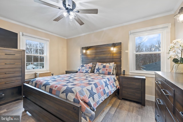 bedroom featuring ornamental molding, ceiling fan, and wood finished floors