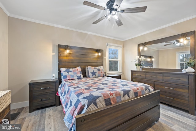 bedroom featuring baseboards, ornamental molding, ceiling fan, and wood finished floors