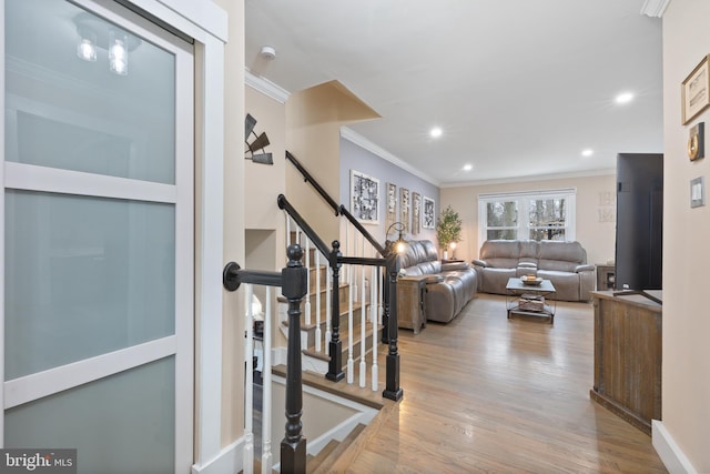 interior space with recessed lighting, crown molding, stairway, and wood finished floors