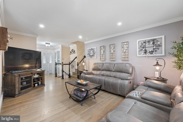 living room featuring ornamental molding, stairway, light wood-type flooring, and recessed lighting