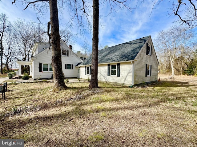 rear view of house featuring a chimney