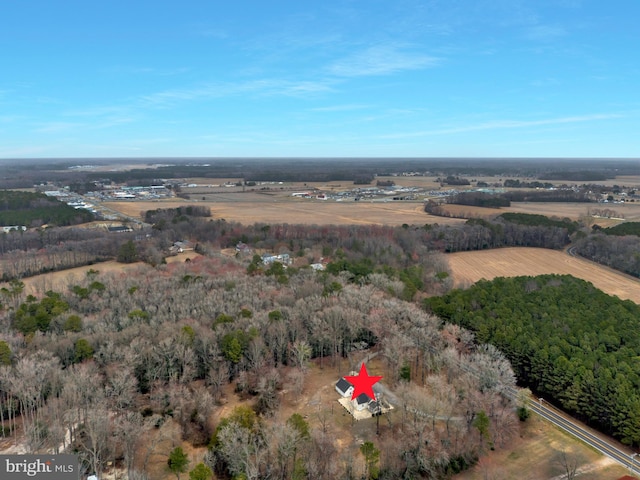 birds eye view of property with a rural view