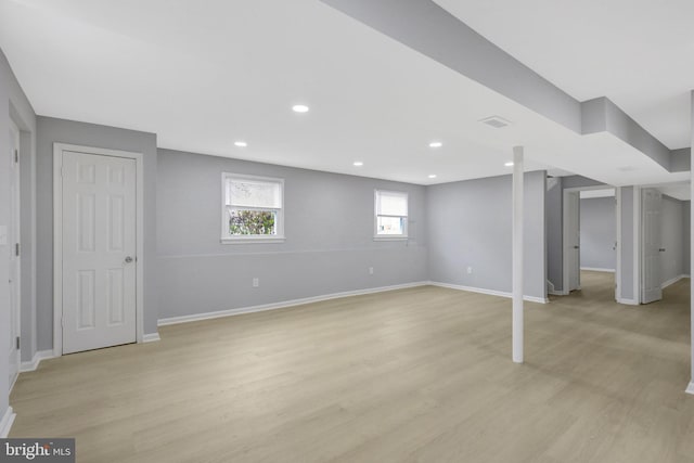 below grade area featuring light wood-style floors, baseboards, and recessed lighting