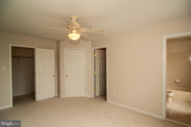241 Thomas Harmon Dr, Camden, DE 19934 - unfurnished bedroom featuring carpet flooring, a closet, a walk in closet, and baseboards