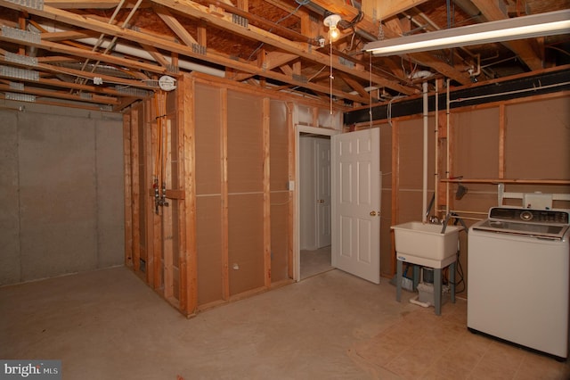 241 Thomas Harmon Dr, Camden, DE 19934 - unfinished below grade area featuring washer / clothes dryer and a sink