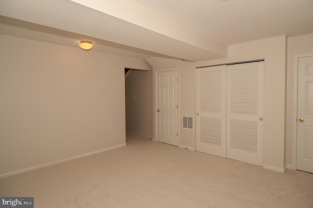 241 Thomas Harmon Dr, Camden, DE 19934 - unfurnished bedroom with light colored carpet, baseboards, and a closet