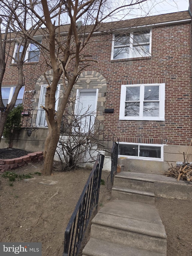 exterior space featuring brick siding