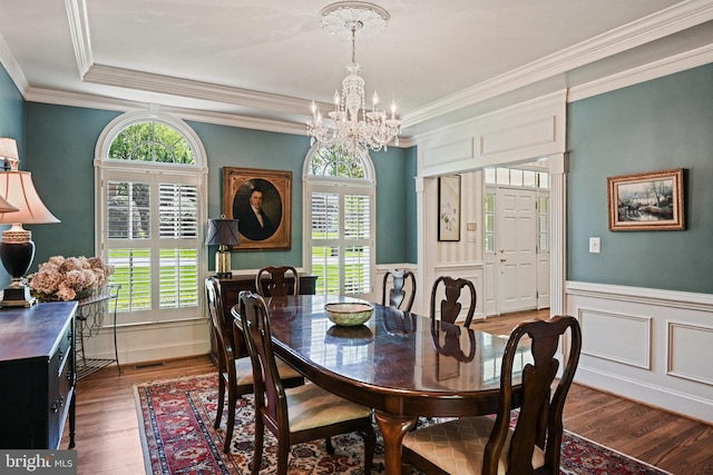 10310 Mystic Meadow Way, Oakton, VA 22124 - dining area with ornamental molding, wood finished floors, a notable chandelier, and a healthy amount of sunlight