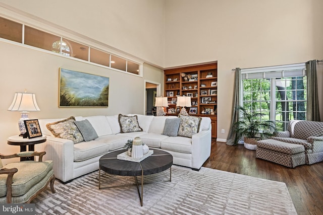 10310 Mystic Meadow Way, Oakton, VA 22124 - living area with built in features, a high ceiling, baseboards, and wood finished floors
