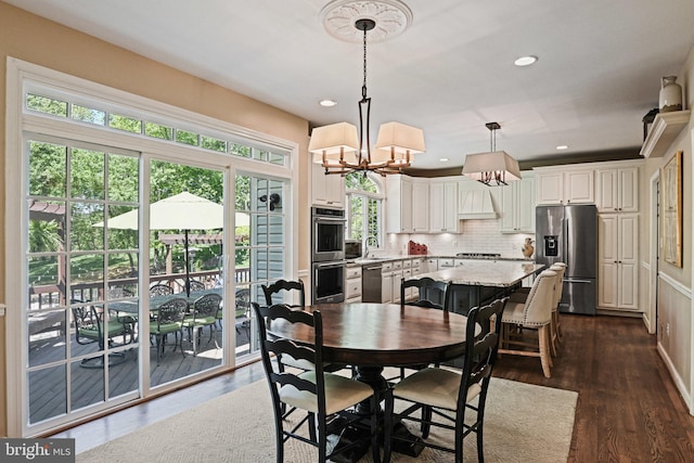 10310 Mystic Meadow Way, Oakton, VA 22124 - dining room with dark wood-style flooring, a notable chandelier, and recessed lighting
