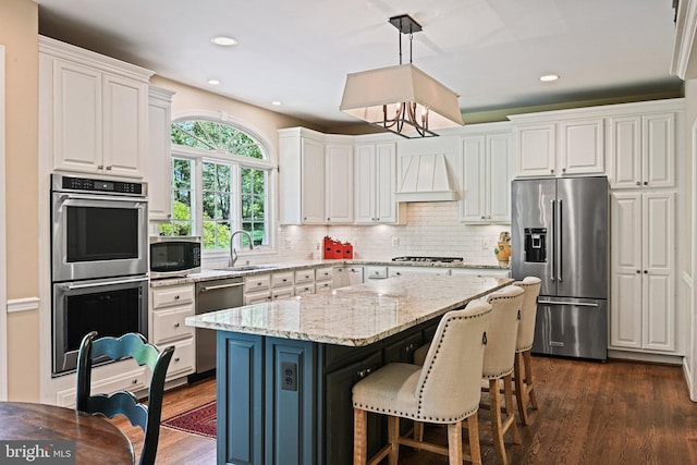 10310 Mystic Meadow Way, Oakton, VA 22124 - kitchen with a sink, custom exhaust hood, stainless steel appliances, white cabinetry, and dark wood-type flooring