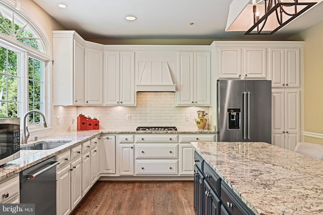 10310 Mystic Meadow Way, Oakton, VA 22124 - kitchen with dark wood-style flooring, white cabinets, custom range hood, a sink, and stainless steel appliances