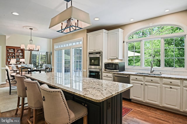 10310 Mystic Meadow Way, Oakton, VA 22124 - kitchen with stainless steel appliances, a notable chandelier, a wealth of natural light, and a sink