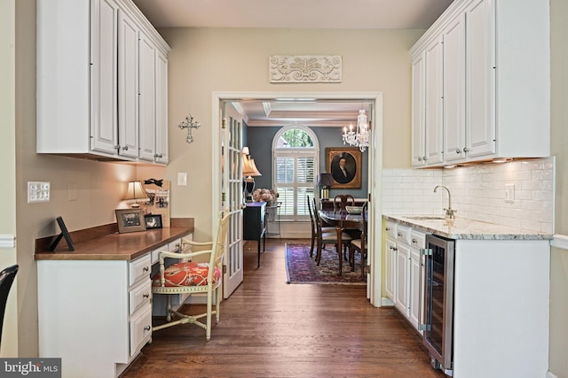 10310 Mystic Meadow Way, Oakton, VA 22124 - kitchen featuring a sink, dark wood-style floors, beverage cooler, and white cabinetry