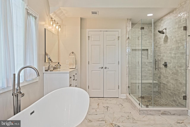 10310 Mystic Meadow Way, Oakton, VA 22124 - bathroom featuring a soaking tub, a stall shower, and marble finish floor