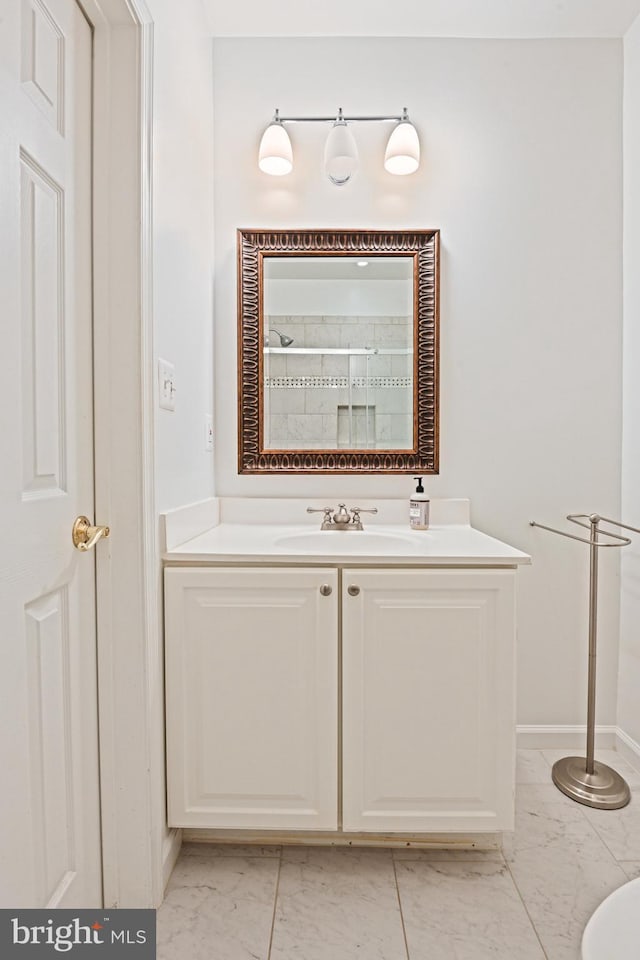 10310 Mystic Meadow Way, Oakton, VA 22124 - bathroom with vanity, marble finish floor, baseboards, and a shower