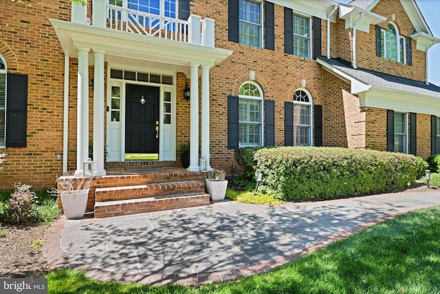 10310 Mystic Meadow Way, Oakton, VA 22124 - property entrance featuring brick siding and a balcony