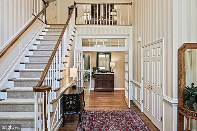 10310 Mystic Meadow Way, Oakton, VA 22124 - entryway featuring a high ceiling, wallpapered walls, stairs, and wood finished floors