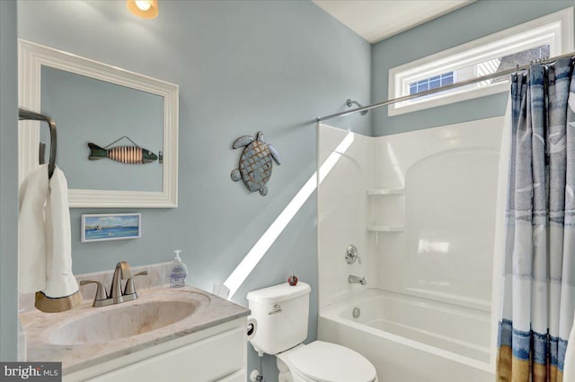 bathroom with vanity, toilet, and shower / tub combo