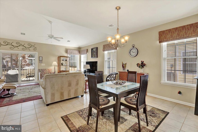 dining room featuring light tile patterned floors, visible vents, and baseboards