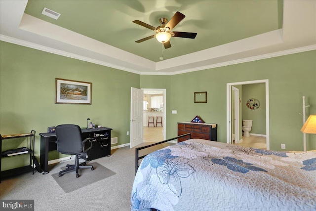 bedroom featuring visible vents, crown molding, baseboards, carpet flooring, and a raised ceiling