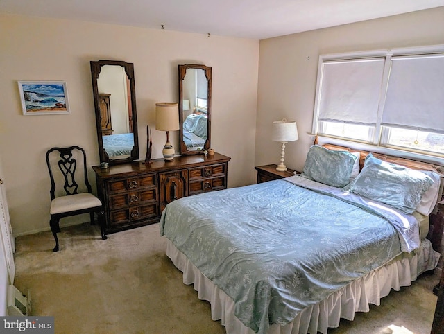 bedroom with light colored carpet