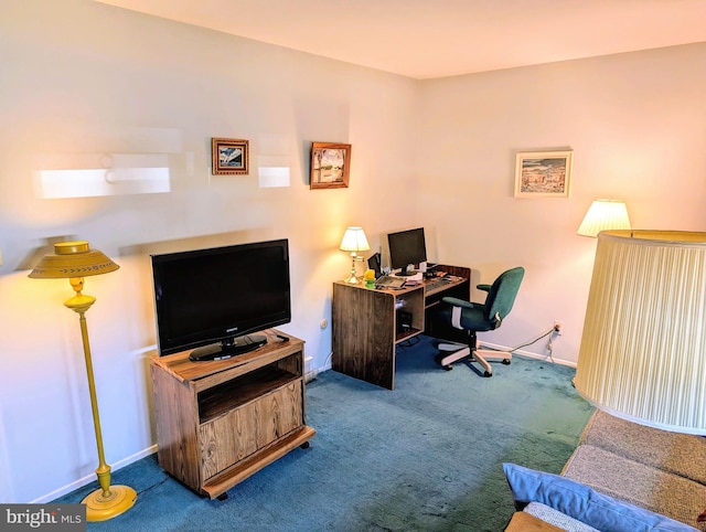 carpeted office featuring baseboards