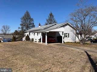 view of property exterior featuring dirt driveway