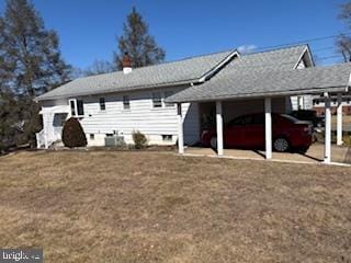 rear view of house with a lawn