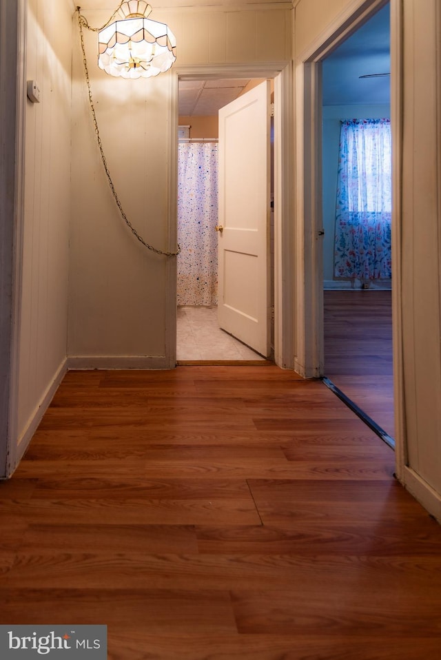 hall with wood finished floors