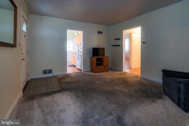 living area with visible vents and carpet flooring