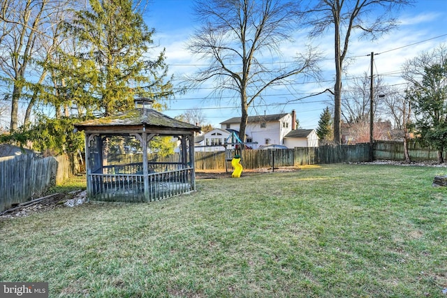 view of yard featuring a gazebo and a fenced backyard