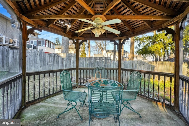 view of patio / terrace with outdoor dining area, a ceiling fan, and fence