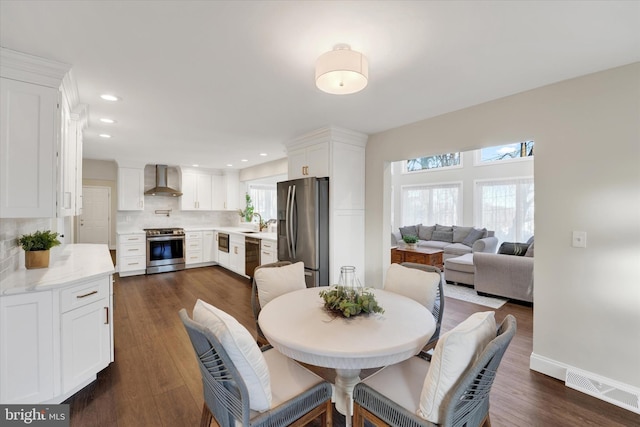 dining area with dark wood-type flooring, recessed lighting, baseboards, and visible vents