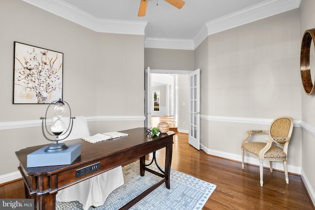 office with crown molding, ceiling fan, baseboards, and wood finished floors