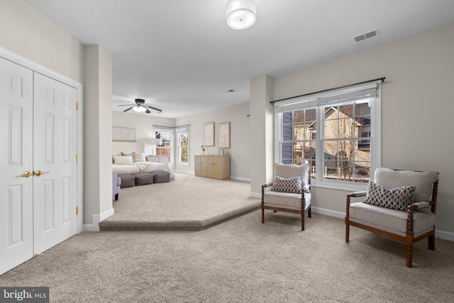 bedroom with baseboards, visible vents, a ceiling fan, carpet floors, and a closet