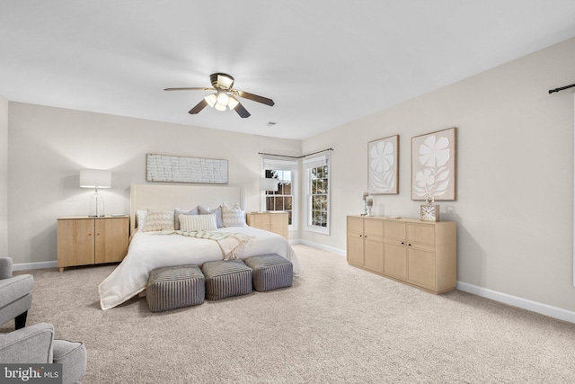 bedroom with carpet and baseboards